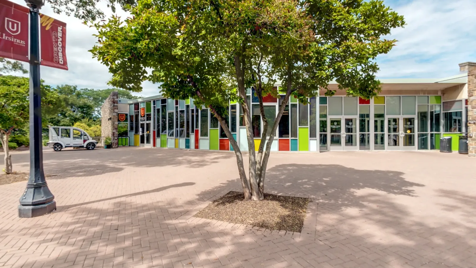 The paved plaza between Olin Hall and the Wismer Center