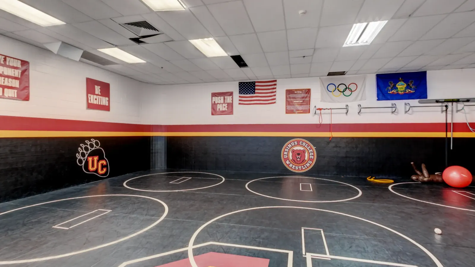 The matted practice room and its wrestling circles