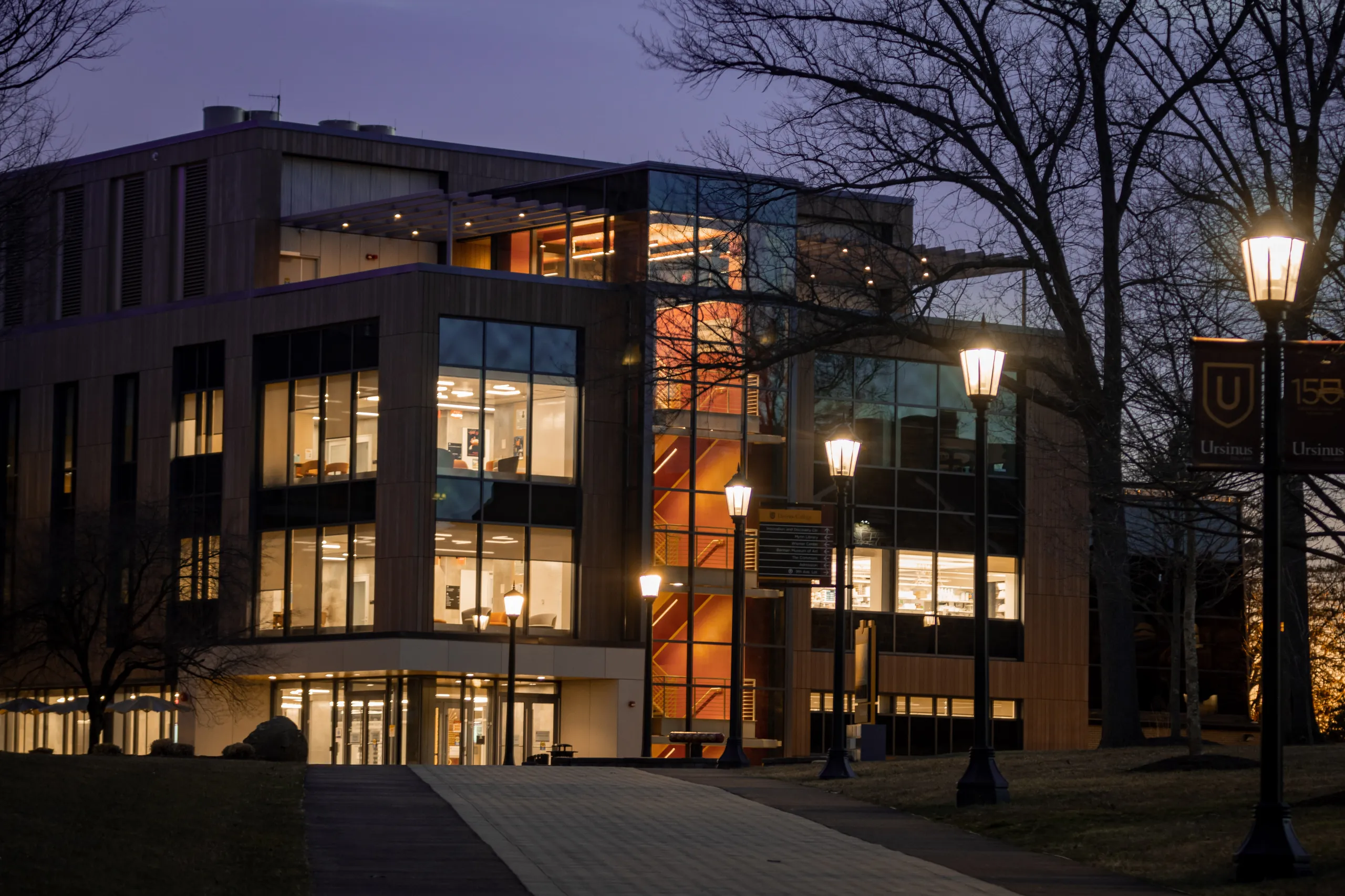 Inside the Innovation and Discovery Center at Ursinus College — the day-lit lobby and glass meeting rooms