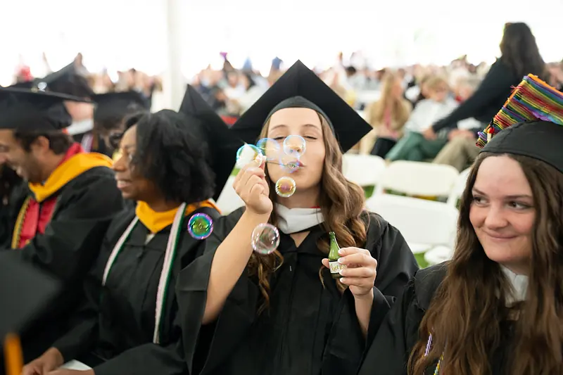 Graduates on Berman Lawn during Commencement