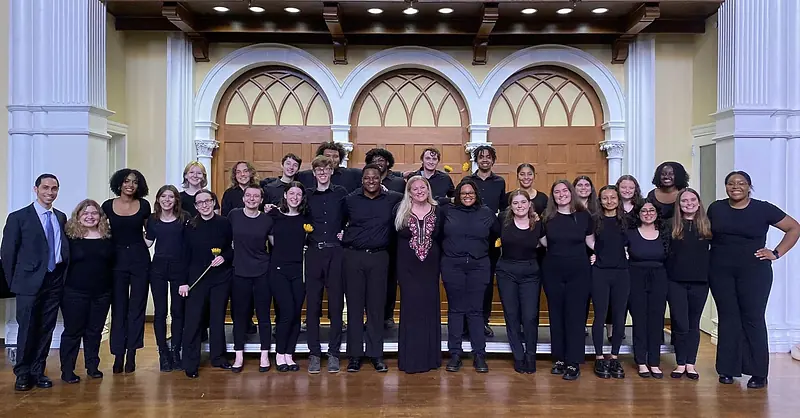 A choir gathered on the Bomberger Auditorium stage for a concert