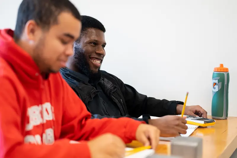 Students working through an assignment together in class