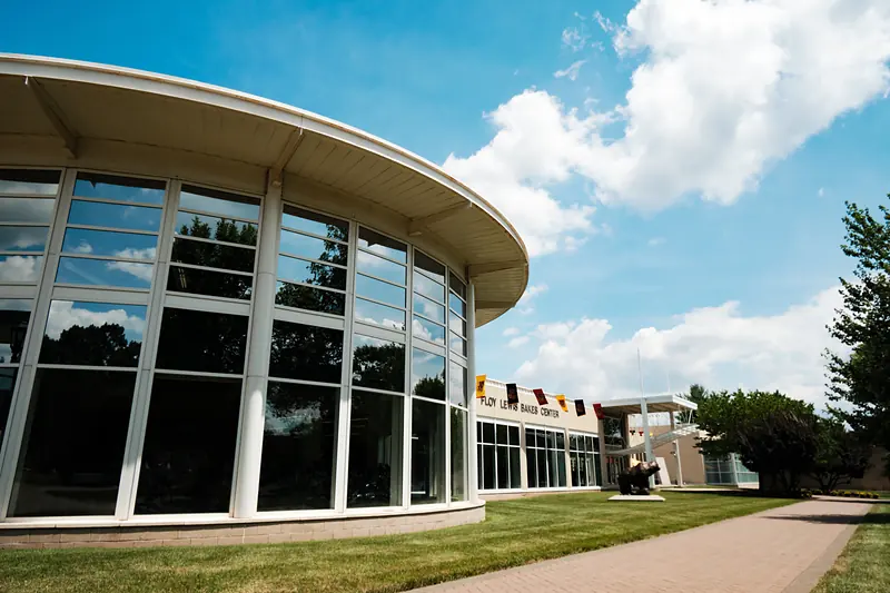 The glass rotunda and entrance of the Floy Lewis Bakes Center