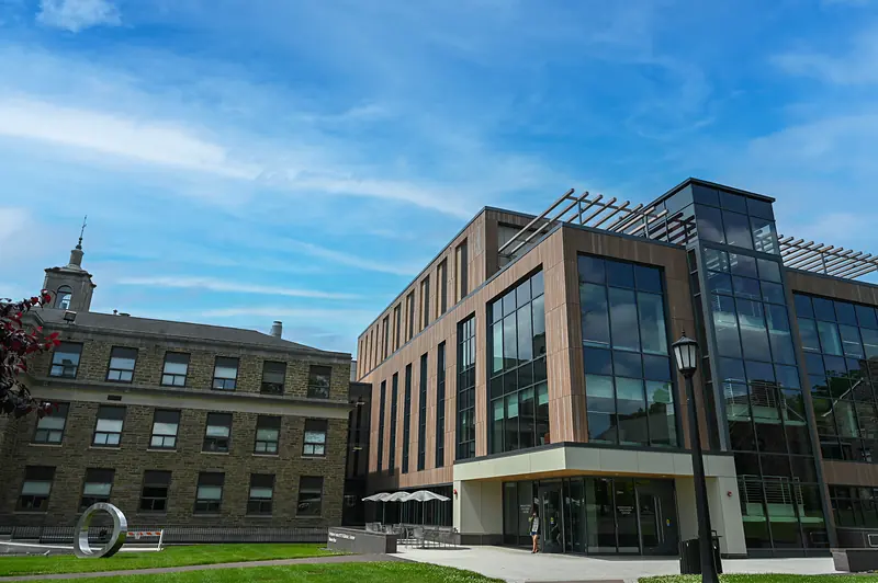 The glass and stone façade of the Innovation and Discovery Center