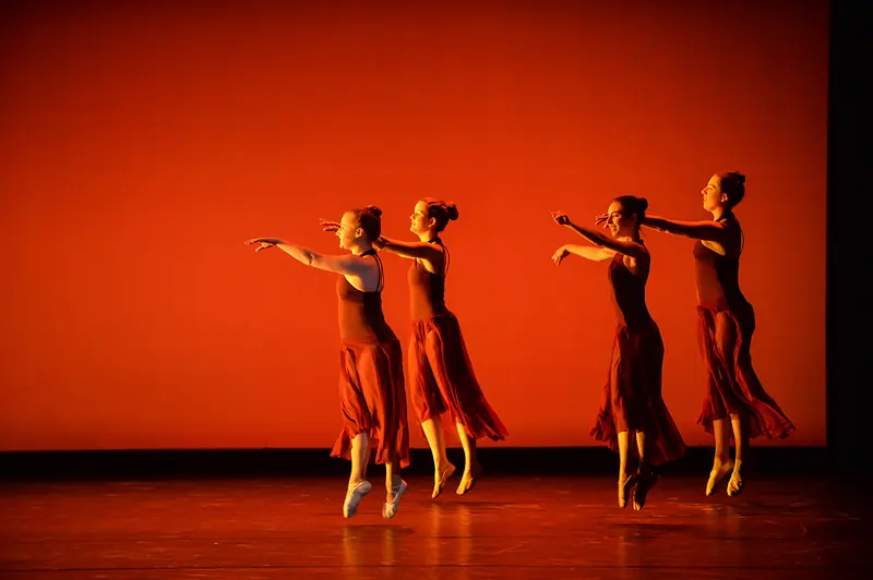Dancers in performance under stage lighting at the Kaleidoscope