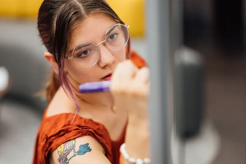 A summer research fellow at work in Myrin Library