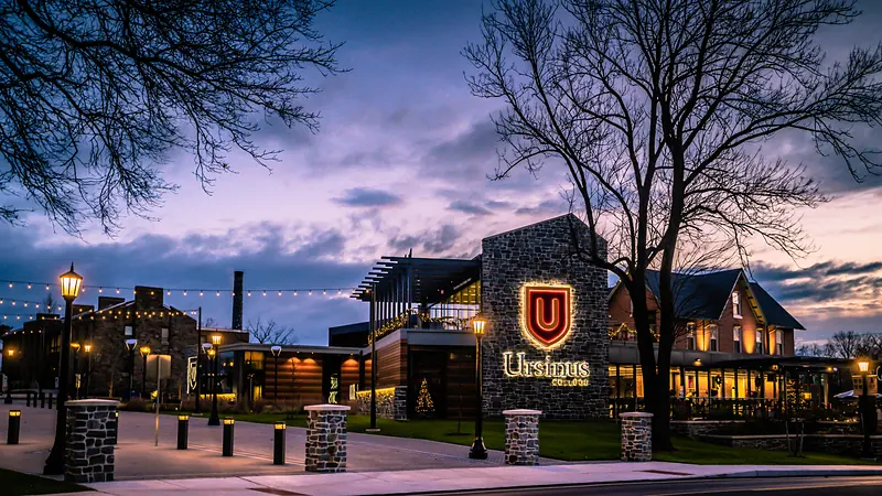 Schellhase Commons and the Ursinus College sign at night