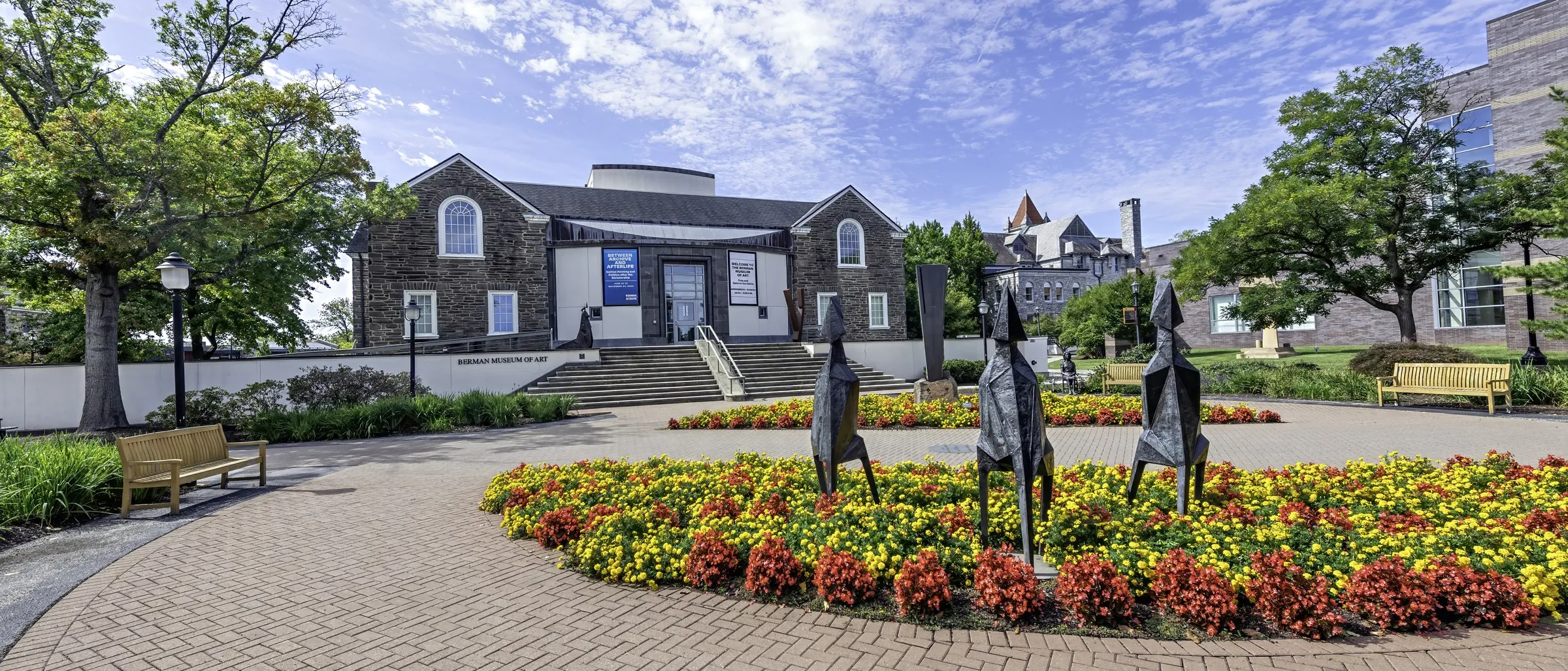 The Berman Museum of Art, its flower beds and the Bomberger Hall tower behind