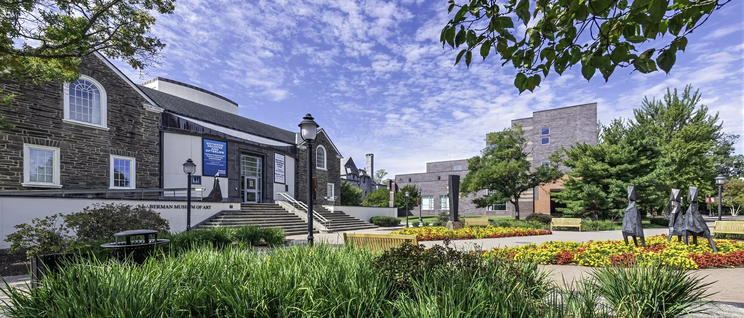The walk past the Berman Museum of Art, with campus buildings beyond