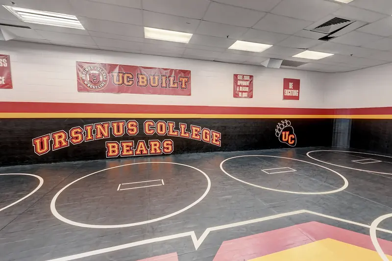 Wrestling circles on the mats below the Ursinus College Bears wall in the Wrestling Room