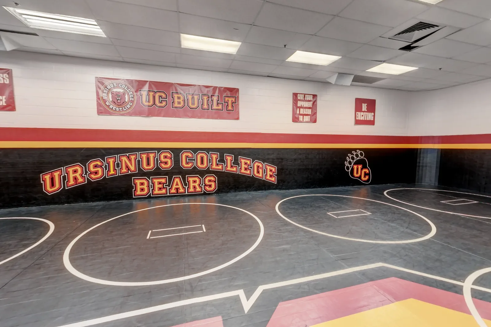Wrestling circles on the mats below the Ursinus College Bears wall in the Wrestling Room