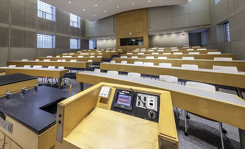 Rows of desks and chairs in Musser Auditorium, seen from the lecture desk