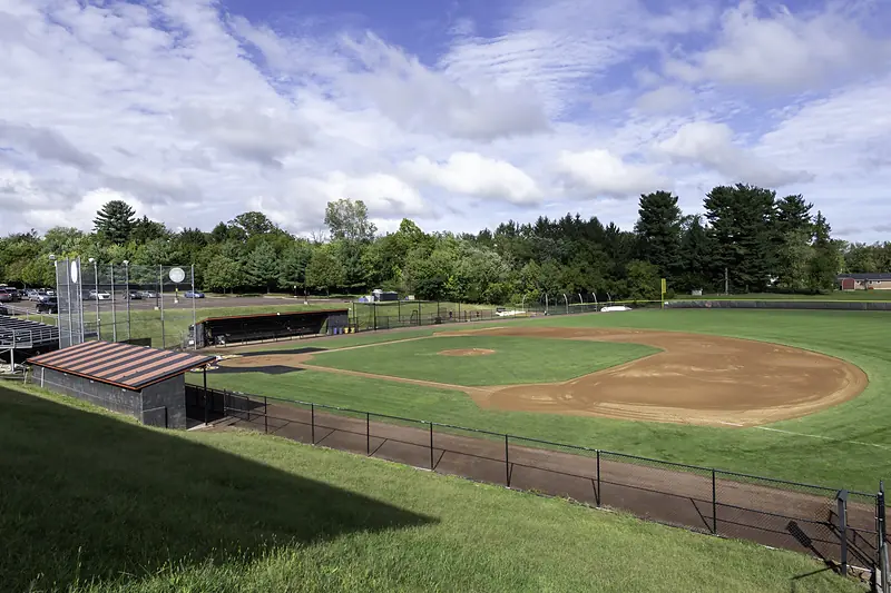 Thomas Baseball Field and its dugouts, seen from the grassy bank above the diamond